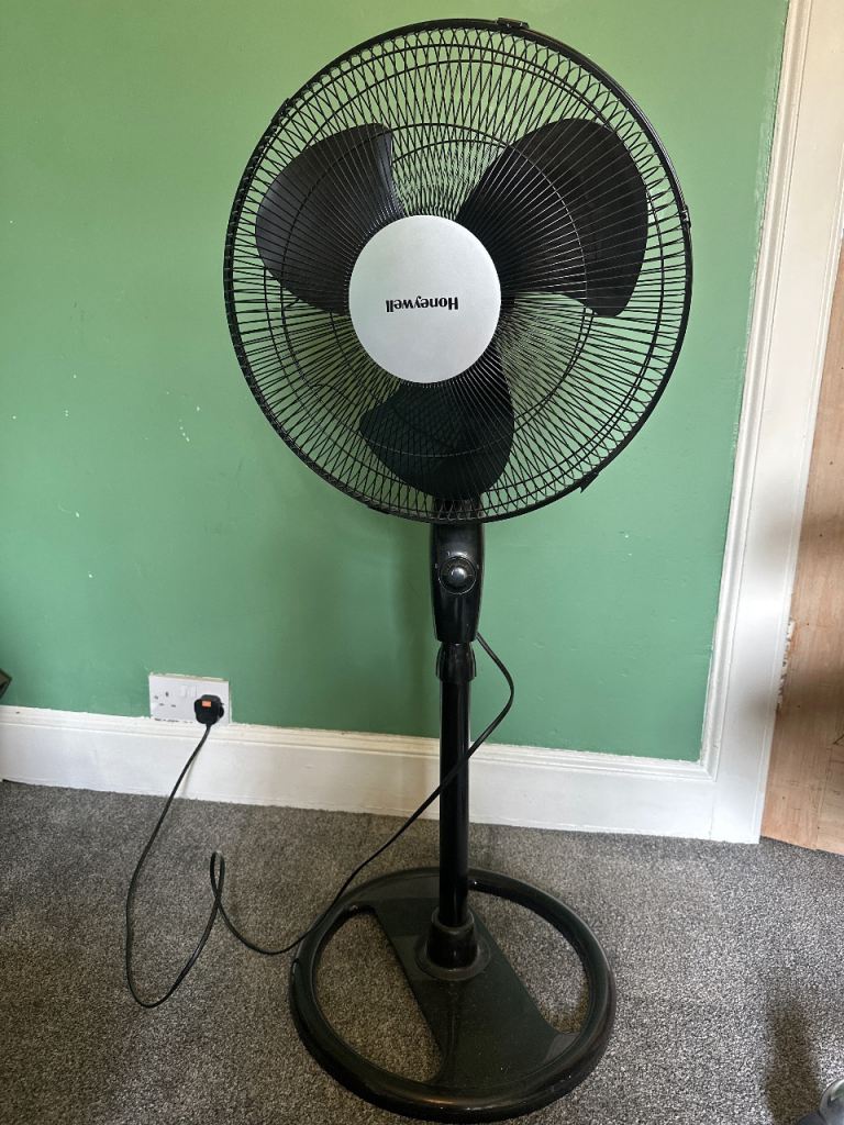 Black Honeywell standing fan. 