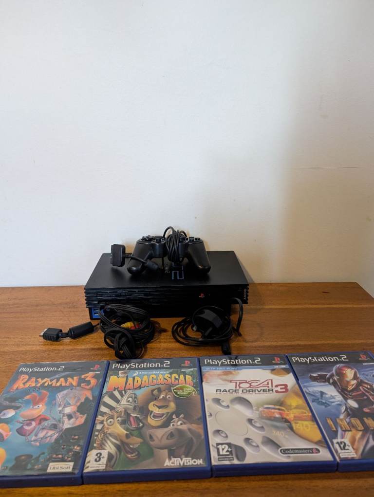 Sony PlayStation 2 With 4 Games and one controller fully working 