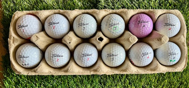 12 Titleist Grade A mixed used golf balls