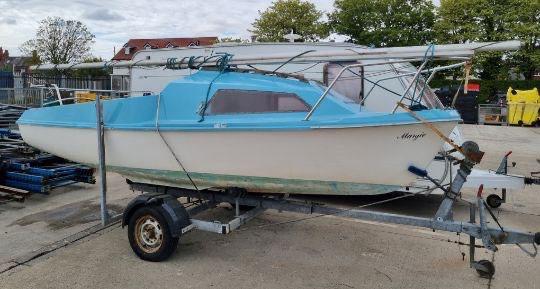 Skipper dinghy.Small boat with trailer.