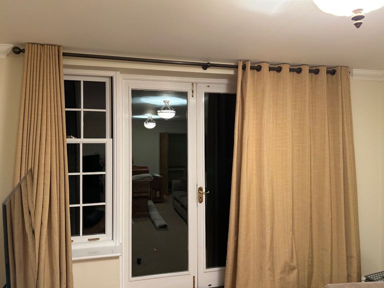 Handmade eyelet lined curtains 