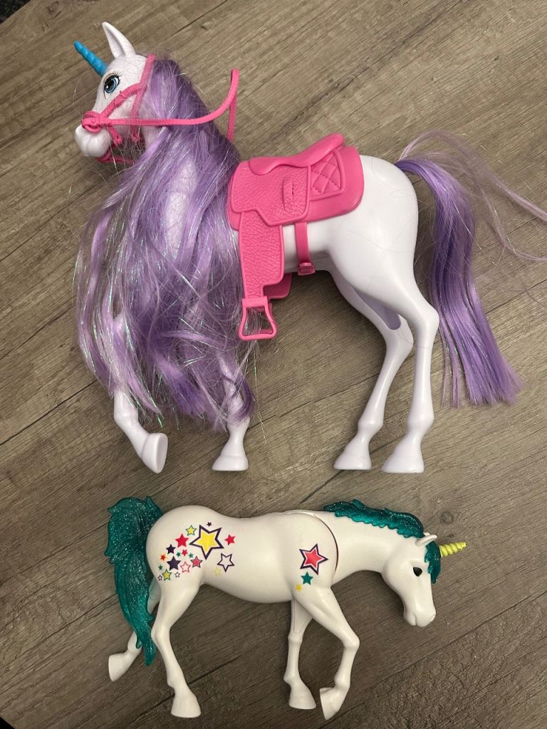 Two Unicorn Toy Horses with Accessories – Good Condition