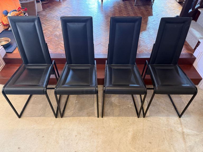 4 designer dining chairs in black leather