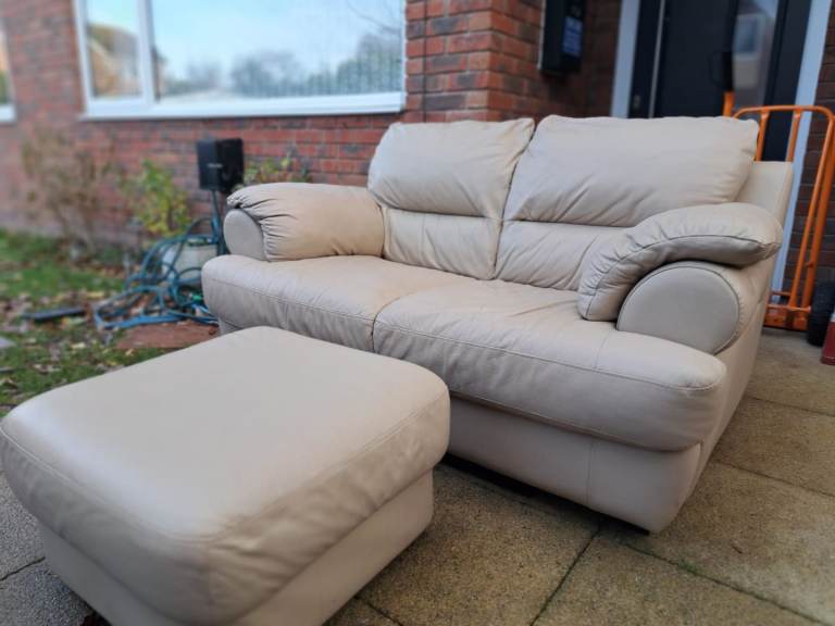 Lovely cream leather sofa and footstool delivery available