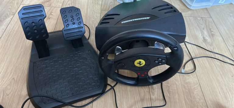 Sony ps3 , pc , and ps2 Thrustmaster ferrari 3 in 1 steering wheels and pedals 