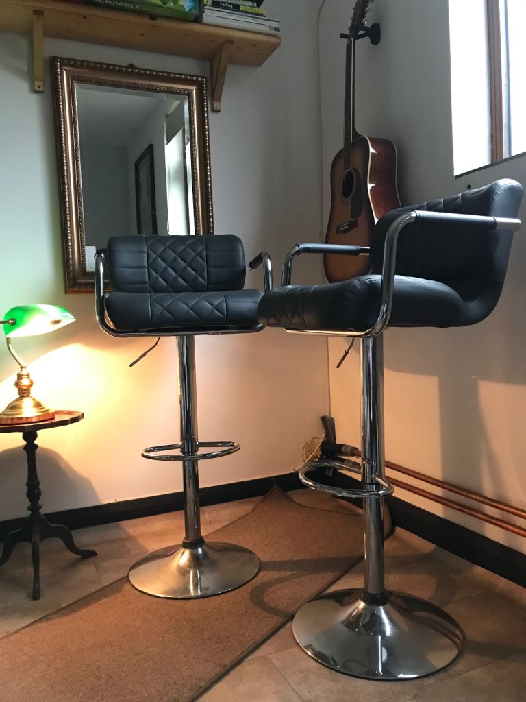 Pair of grey leather bar stools