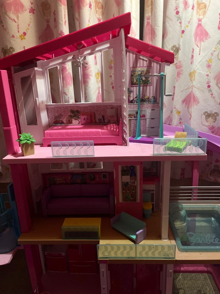 Barbie dream house with accessories and Barbie car