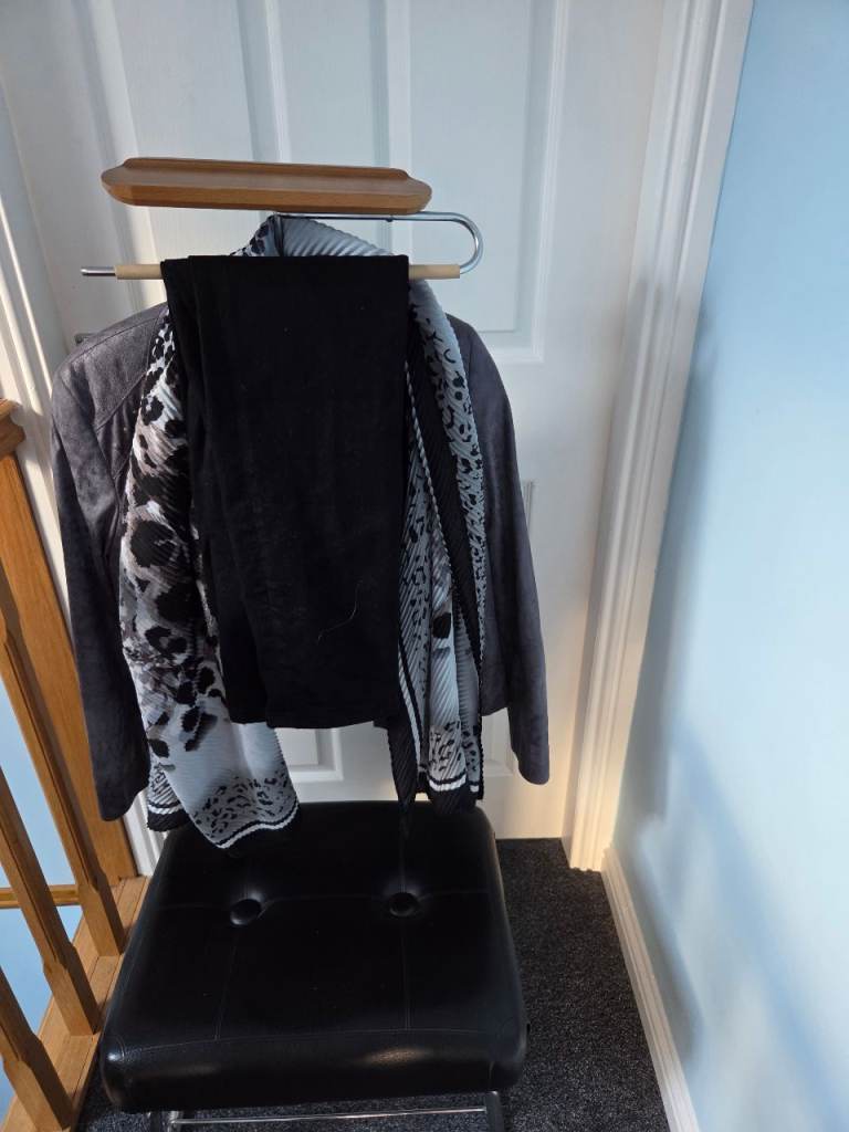 Stand for holding clothes etc