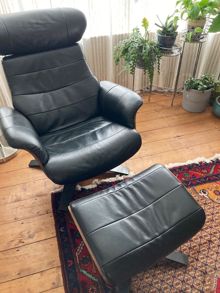 Leather reclining chair and footstool. 