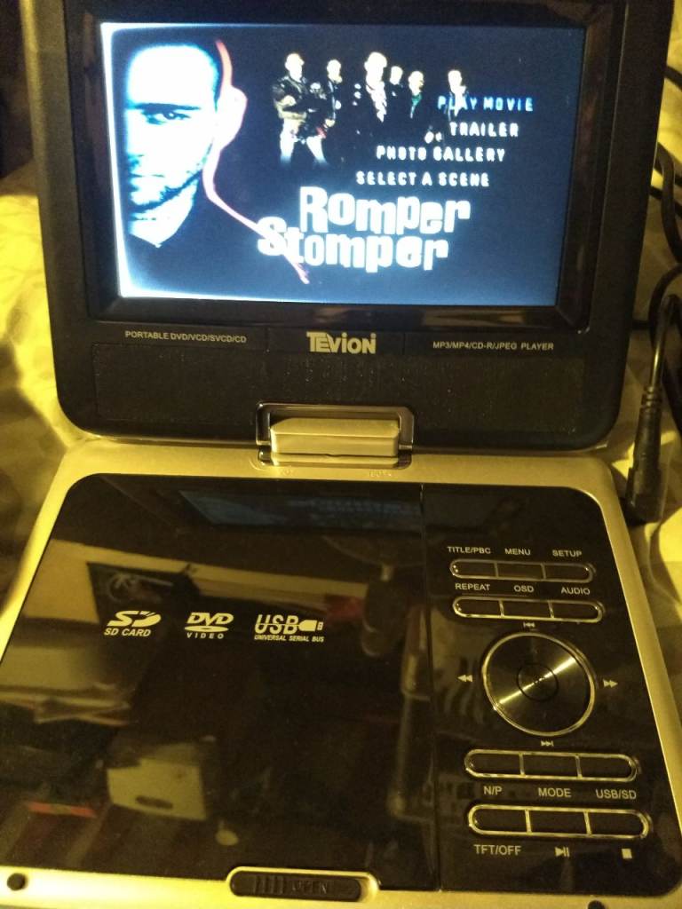 Tevion portable 7 inch screen DVD player for car/home. rechargeable. USB/SD card. Remote control