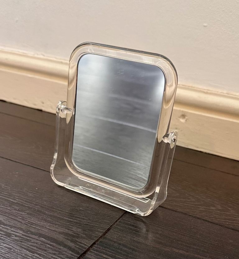 Small Rotating Mirror with Magnified and Regular Side