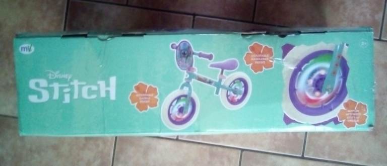 GIRLS STITCH BALANCE BIKE.12 INCH LIGHT UP WHEELS. NEW BOXED.