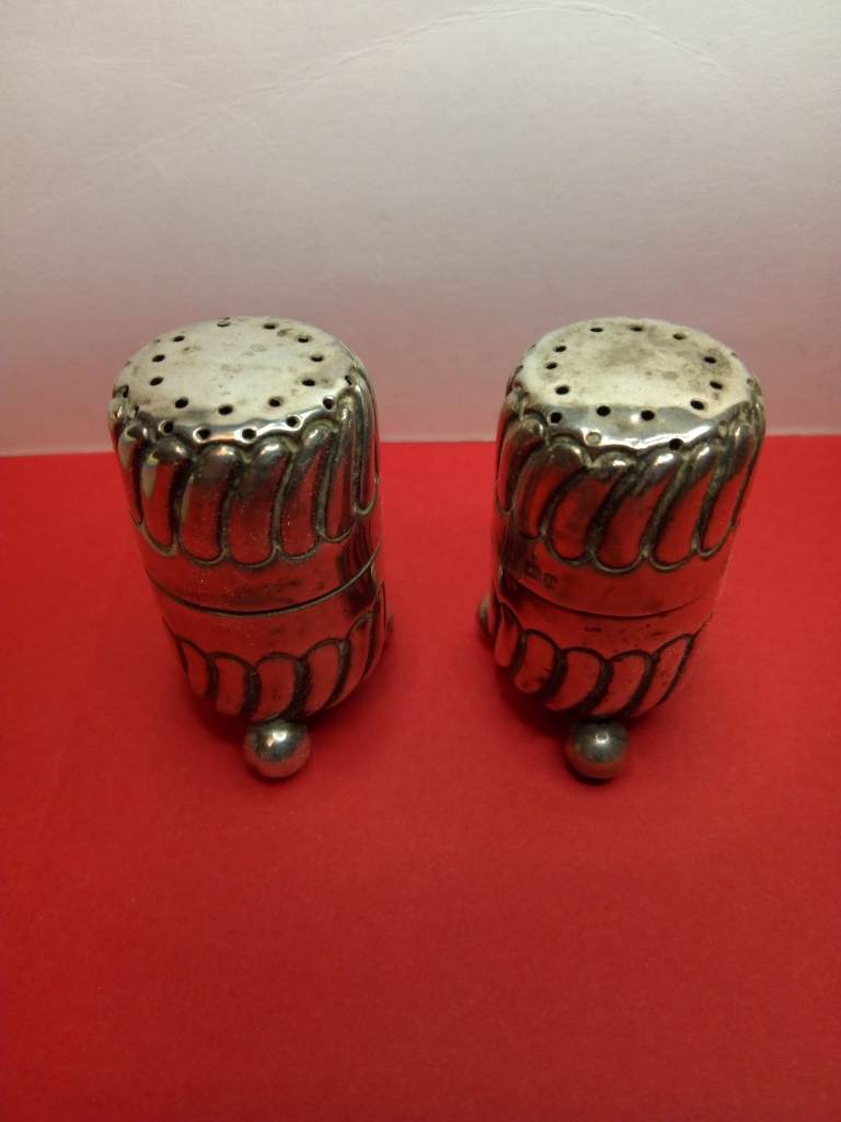 Attractive pair of antique silver peppers 