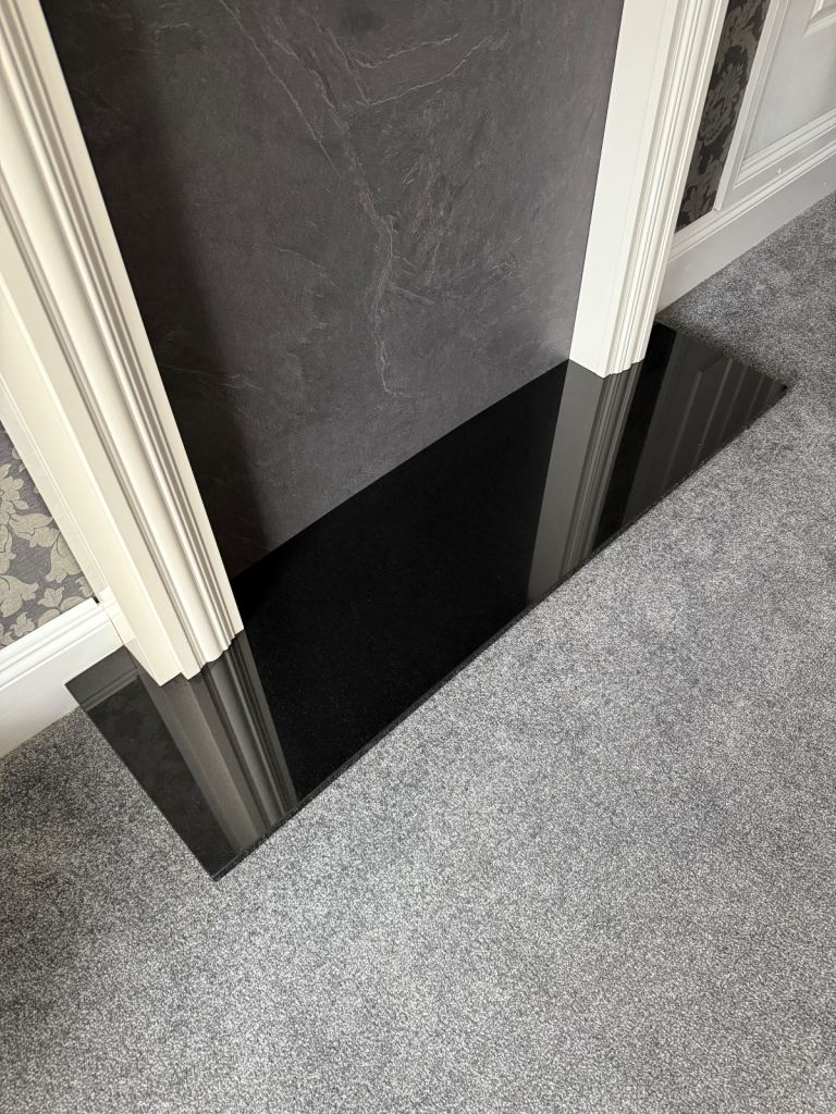Black granite hearth. 