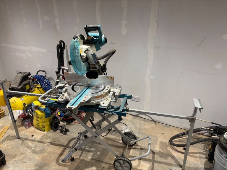 image for Makita LS1219L/2 305mm (12”) Mitre Saw with Makita DEAWST05  Trolley Stand