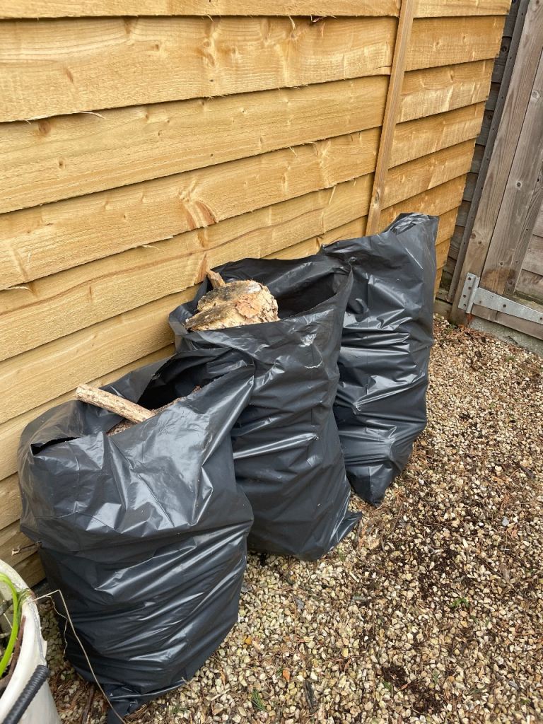 Bags of dried wood logs 