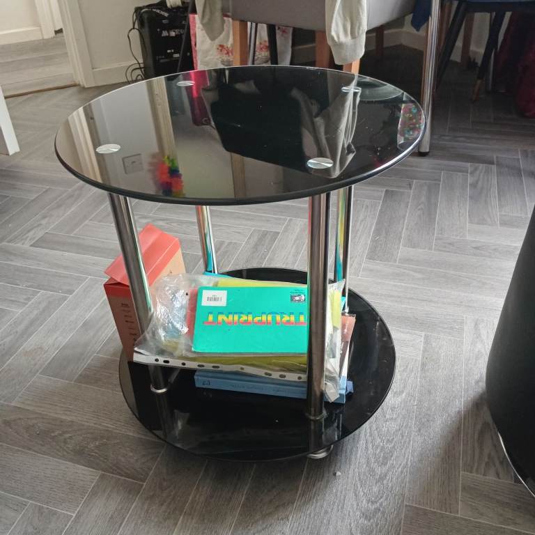 Round black glass coffee table