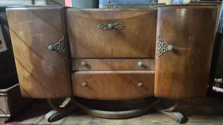 This vintage Art Deco cocktail cabinet or sideboard
