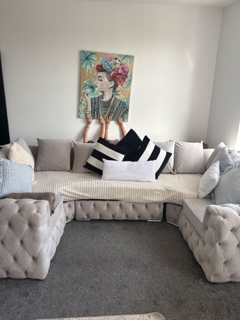 Painting behind the sofa