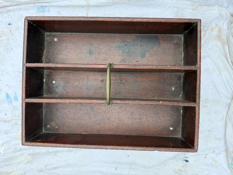 Antique butlers tray on a stand.