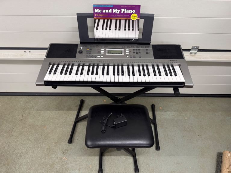 Yamaha PSR E353 with stand music holder and stool and starter piano book
