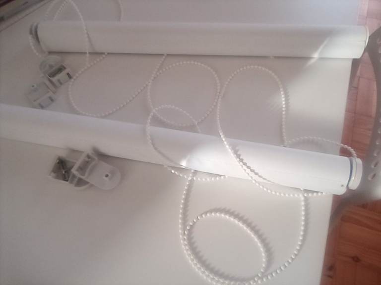 White roller blind to fit window 54cm wide (or can be altered to fit narrower window). 
