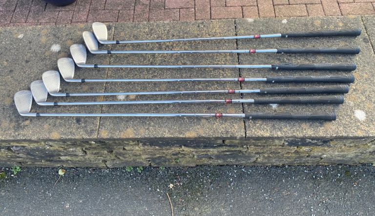 Part set of golf clubs