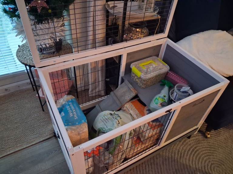 Indoor rabbit hutch with food, bedding and accessories