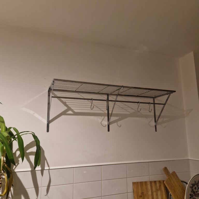 Metal kitchen wall shelf with mug storage - excellent condition.