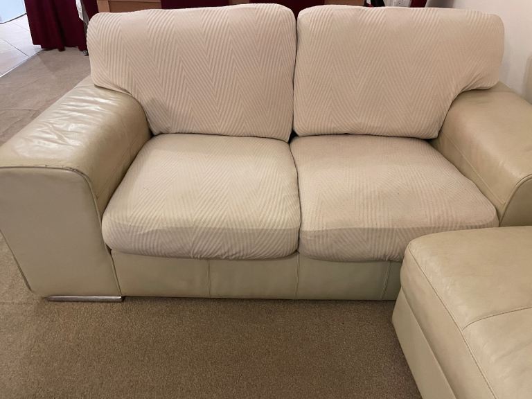 Cream Leather Two-Seater and three-seater sofa with matching footstool