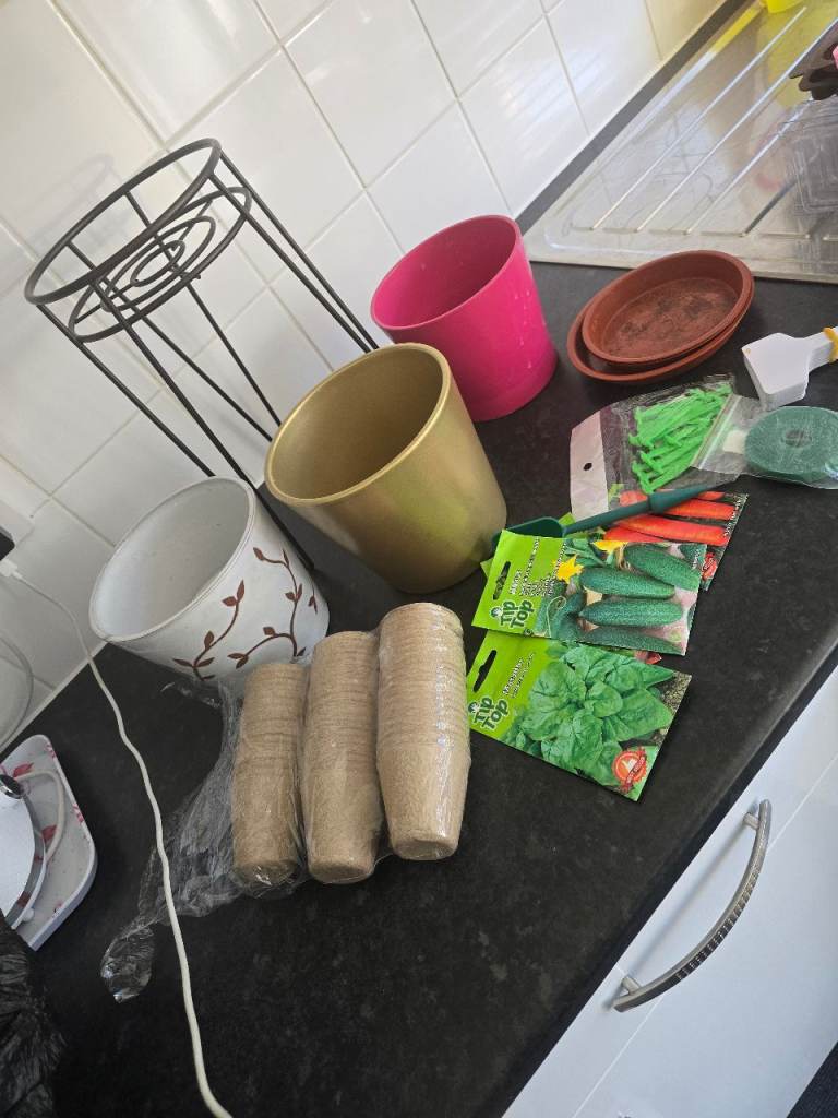 Selection of Plant Pots, Seeds, and Garden Accessories