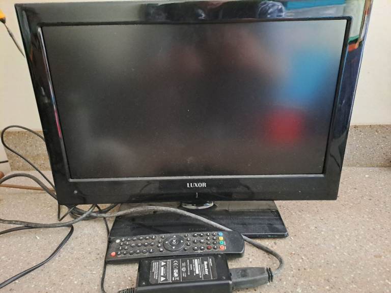 Luxor 19-inch TV with Remote and Power Supply – Good Condition