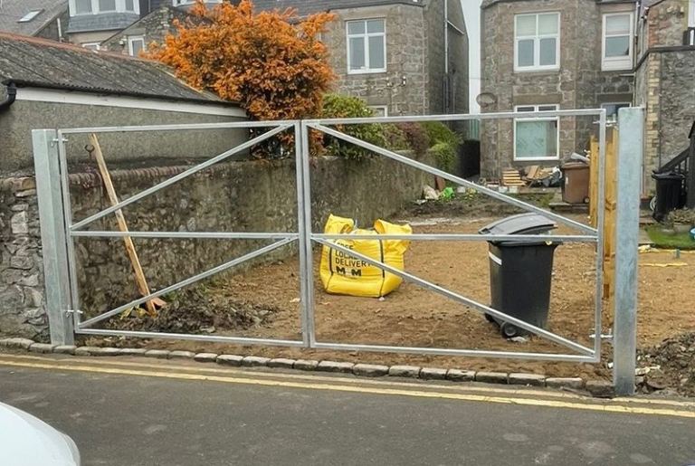 Metal gates and gateposts with NEW unused electric swing motor kit 