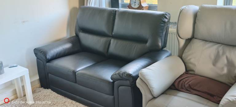 2 seat high backed leather settee in mint condition.