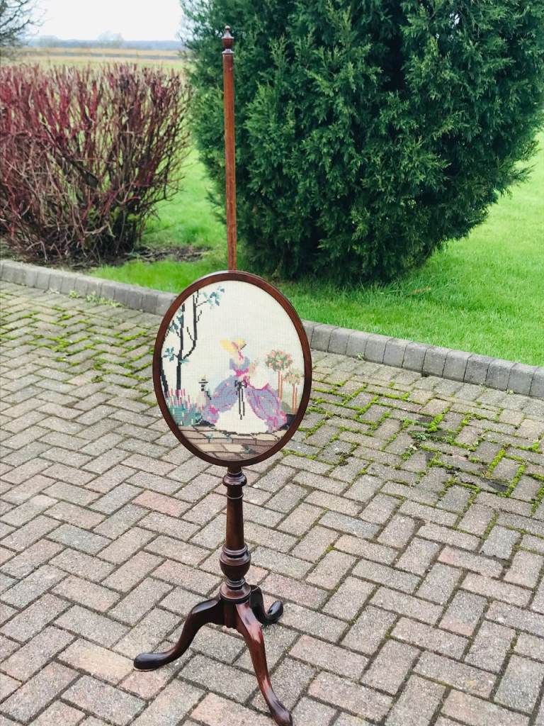 A MAHOGANY TAPESTRY POLE SCREEN.