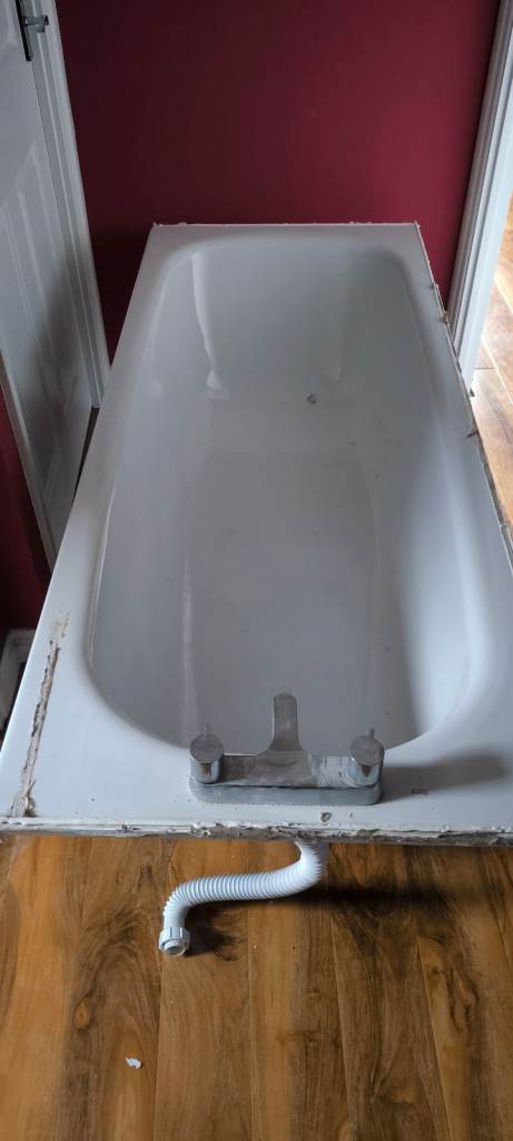 Old White Bathtub with Taps
