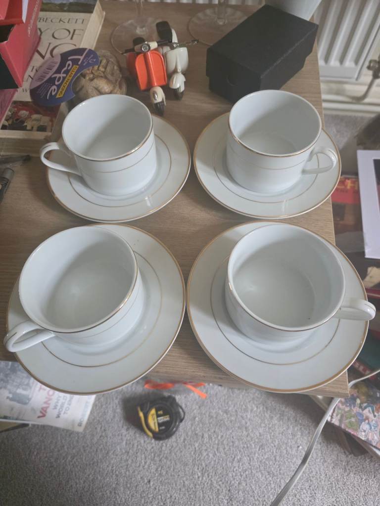 Four cups and saucers 