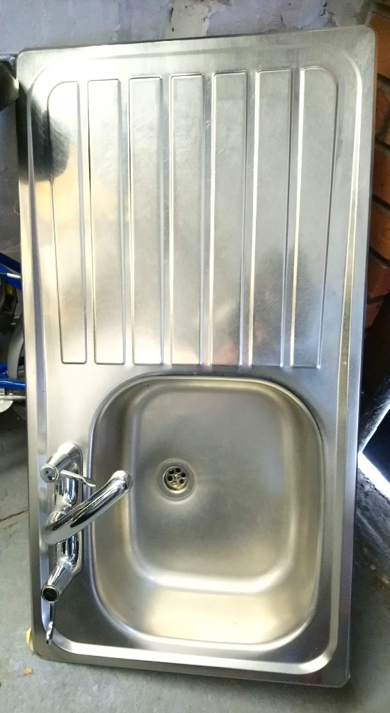 Kitchen sink with tap, Shower bar, Tile, trim, iron work, Laminate floor, Blind.