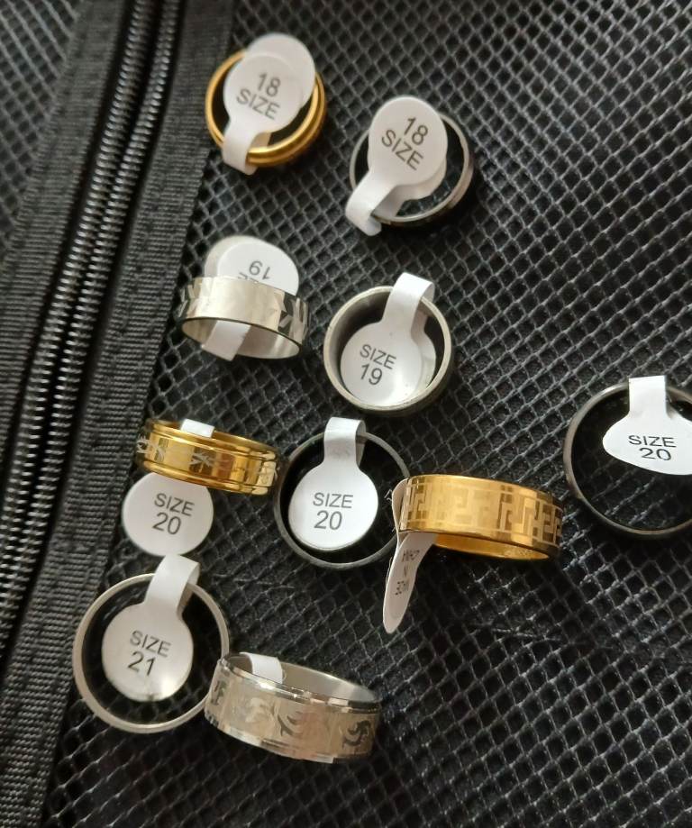 10 BRAND NEW STAINLESS STEEL RINGS VARIOUS SIZES SOME ENGRAVED SOME PLAIN 