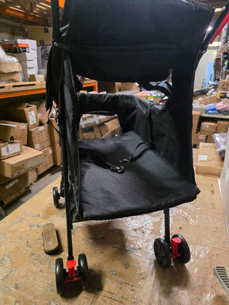A new black Pet Stroller with 3 way access . 