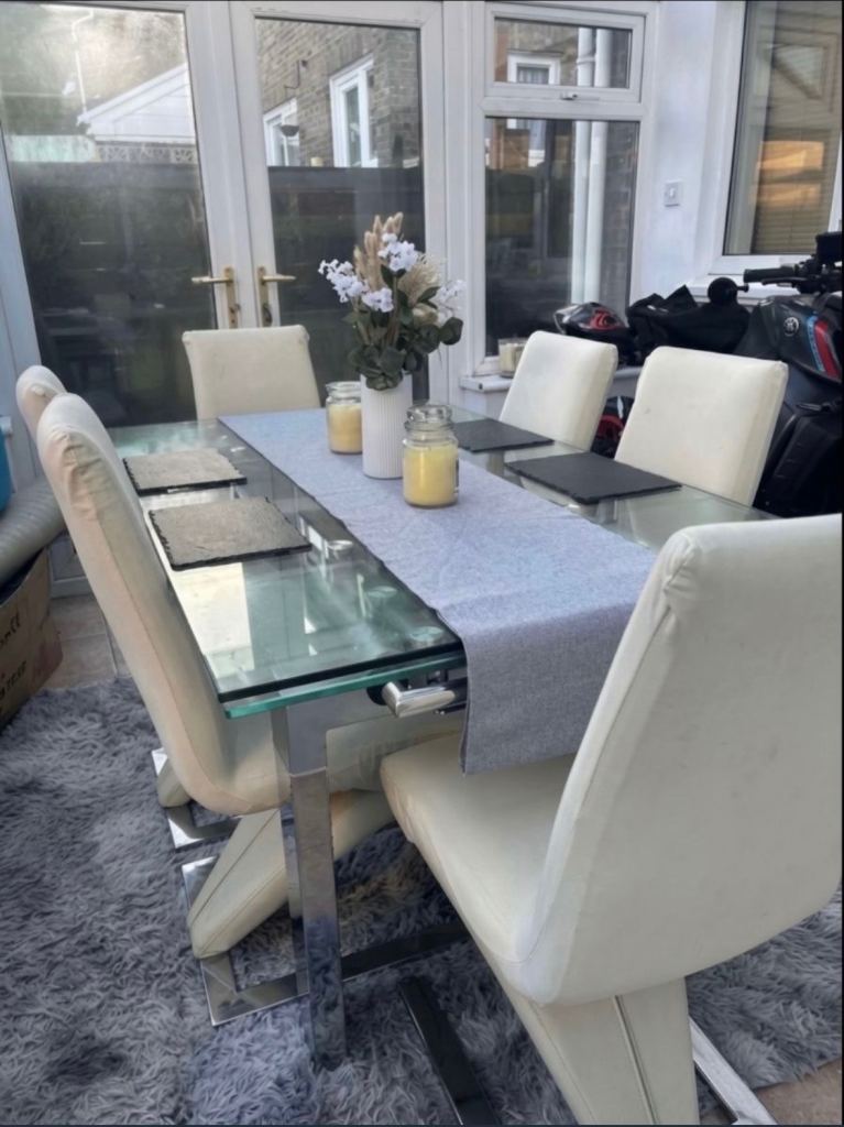 Glass extending dining table (includes chairs) 