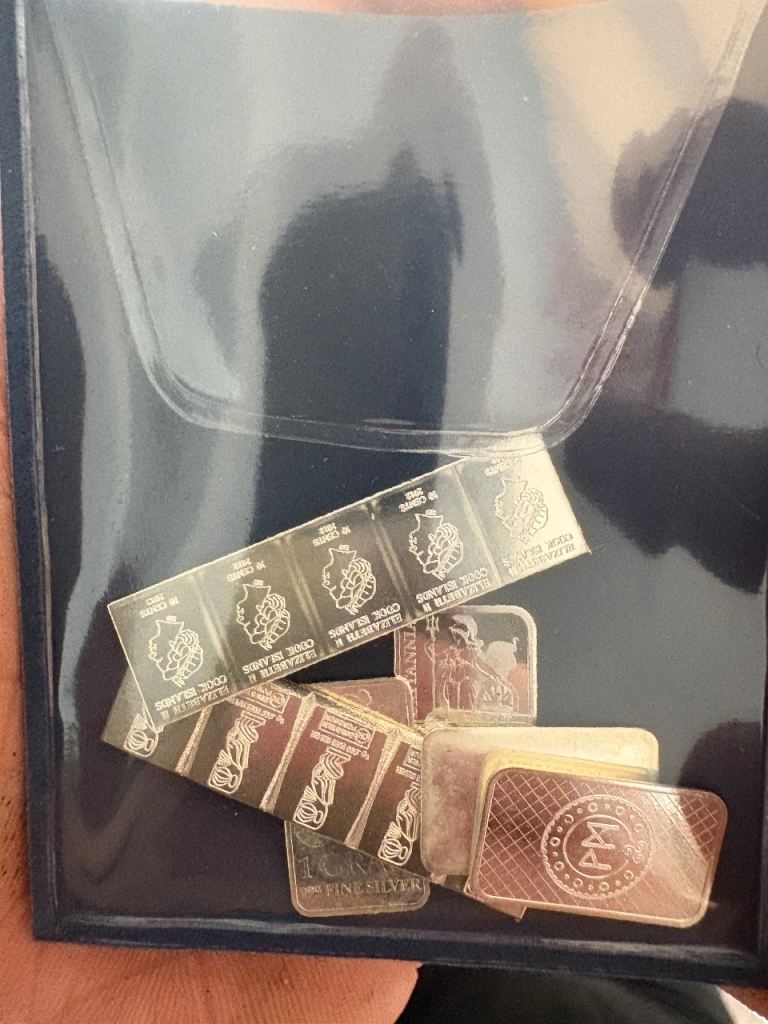 Mix of Silver Bullion Bars and Foils in Folder