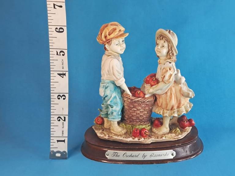Vintage collectible figurine titled "The Orchard" by The Leonardo Collection. 