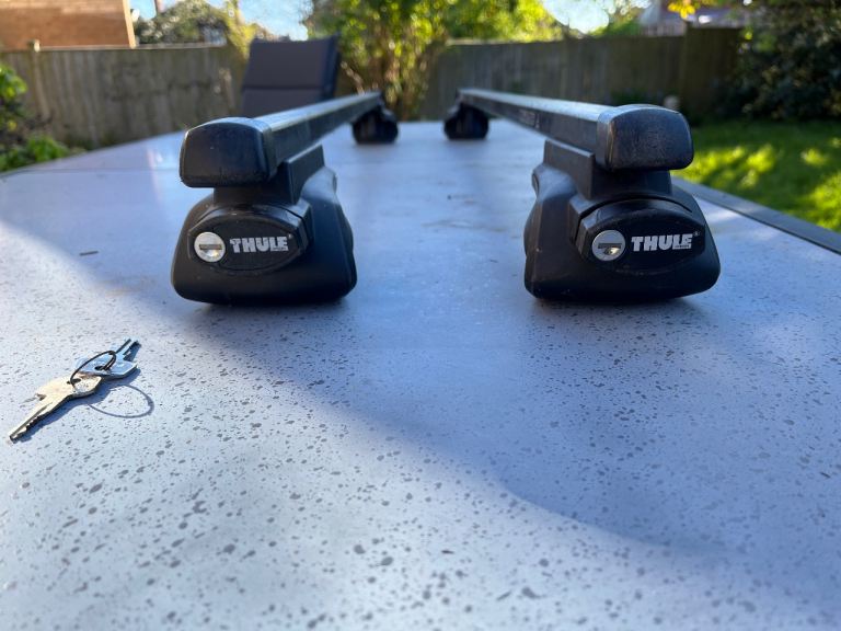 Roof bars for raised roof rails