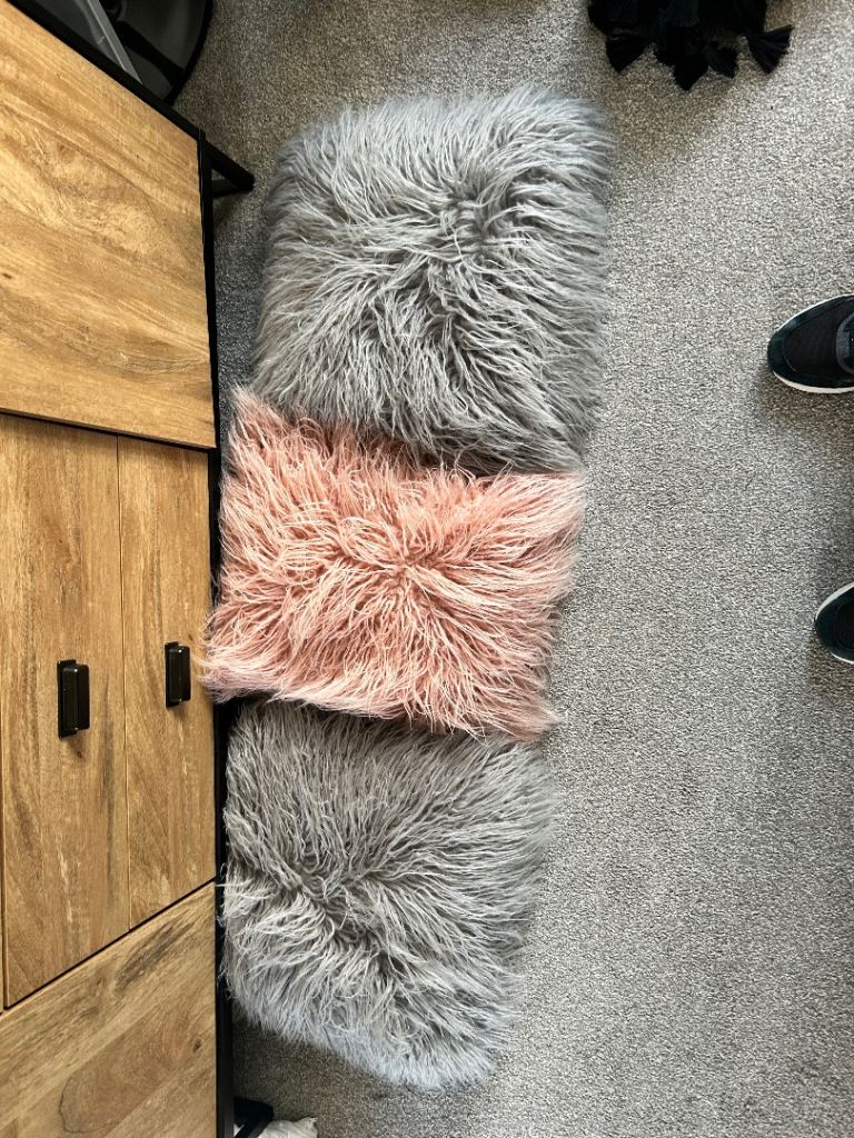Three fluffy cushions 