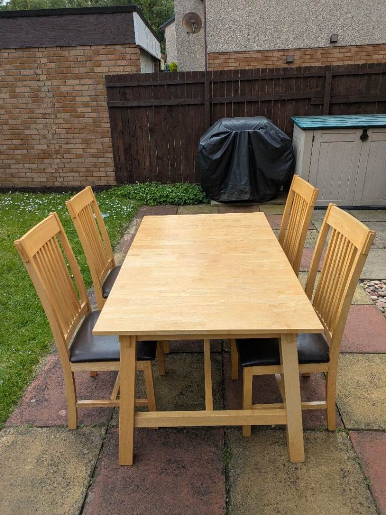 Solid wood dining table and four chairs 