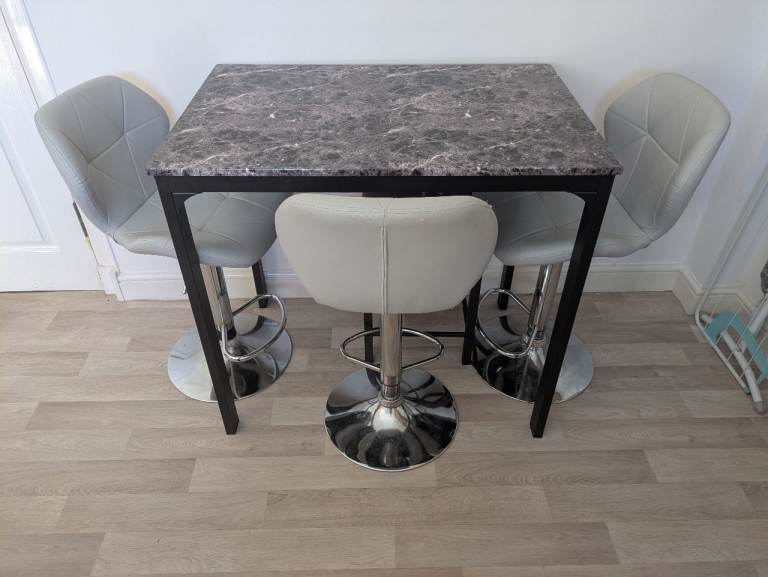 Grey marble dining table set.