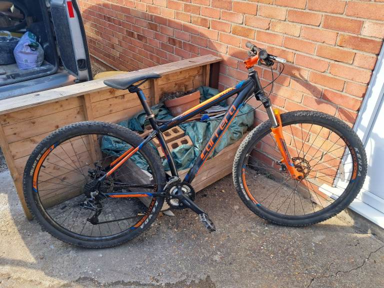 Carrera Mountain Bike – Black and Orange, Good Condition