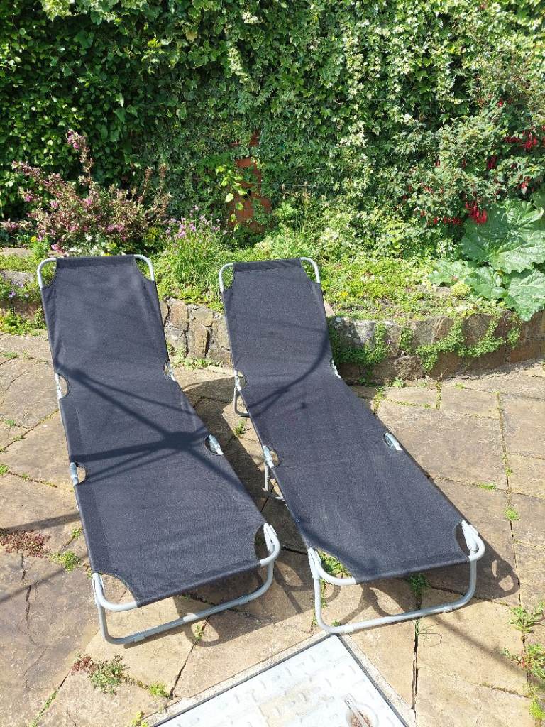Two folding sun loungers 