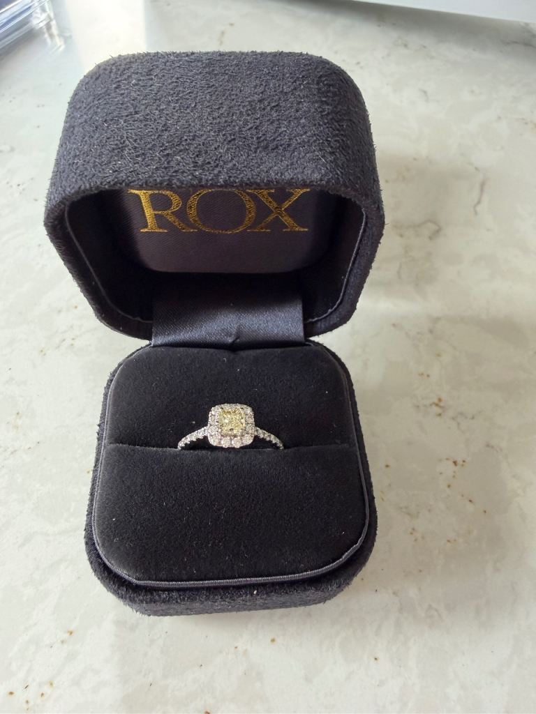 Yellow diamond halo engagement ring
